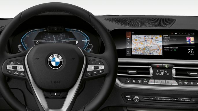 BMW 3 Series Sedan, 330e Cockpit. Detailed frontal view of the BMW 3 Series Sedan cockpit with i-specific display.