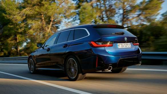 BMW 3 Series Touring plug-in hybrid G21 three-quarter rear view BMW 3 Series Touring plug-in hybrid G21 three-quarter rear view driving