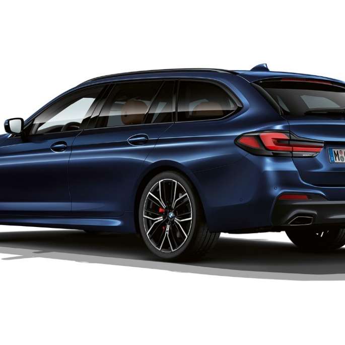 BMW 5 Series Touring G31 M Sport package rear BMW 5 Series Touring 530e G31 2020 M Sport package in Tansanite Blue II metallic three-quarter rear view