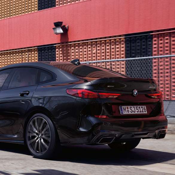 BMW M235i xDrive Gran Coupé three-quarter rear view BMW M235i xDrive Gran Coupé 2020 Black Sapphire metallic F44 three-quarter rear view exterior