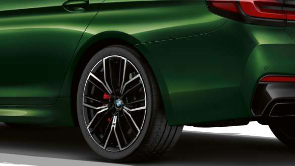 BMW M550i xDrive with M sport differential G30 2020 BMW M550i xDrive Sedan with M sport differential G30 LCI Facelift 2020 BMW Individual Verde Ermes metallic close-up rear wheel