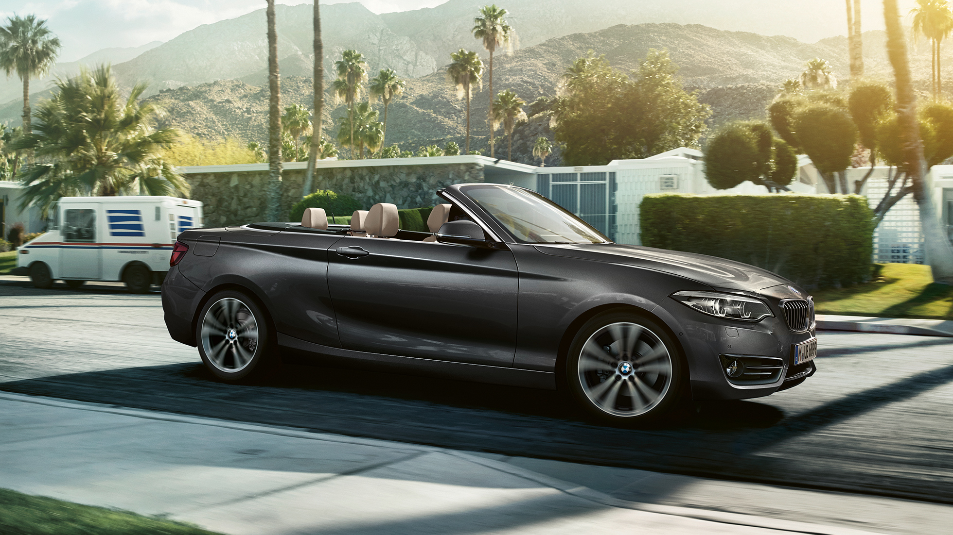 BMW 2 Series Convertible, driving shot from the side BMW 2 Series Convertible, driving shot from the side