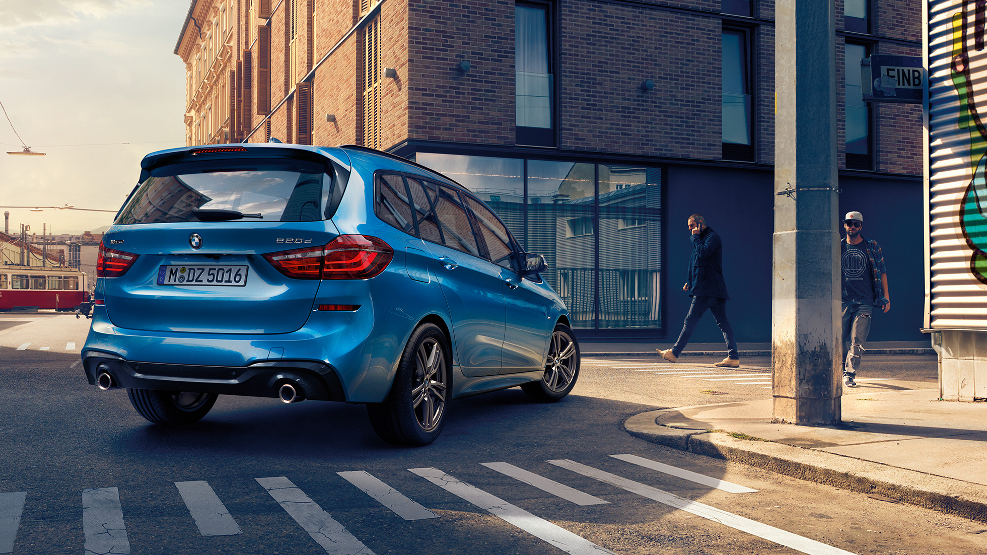 Exterior BMW 2 Series Gran Tourer Exterior BMW 2 Series Gran Tourer 220d xDrive F46 2018 Misano Blue metallic three-quarter rear view driving downtown