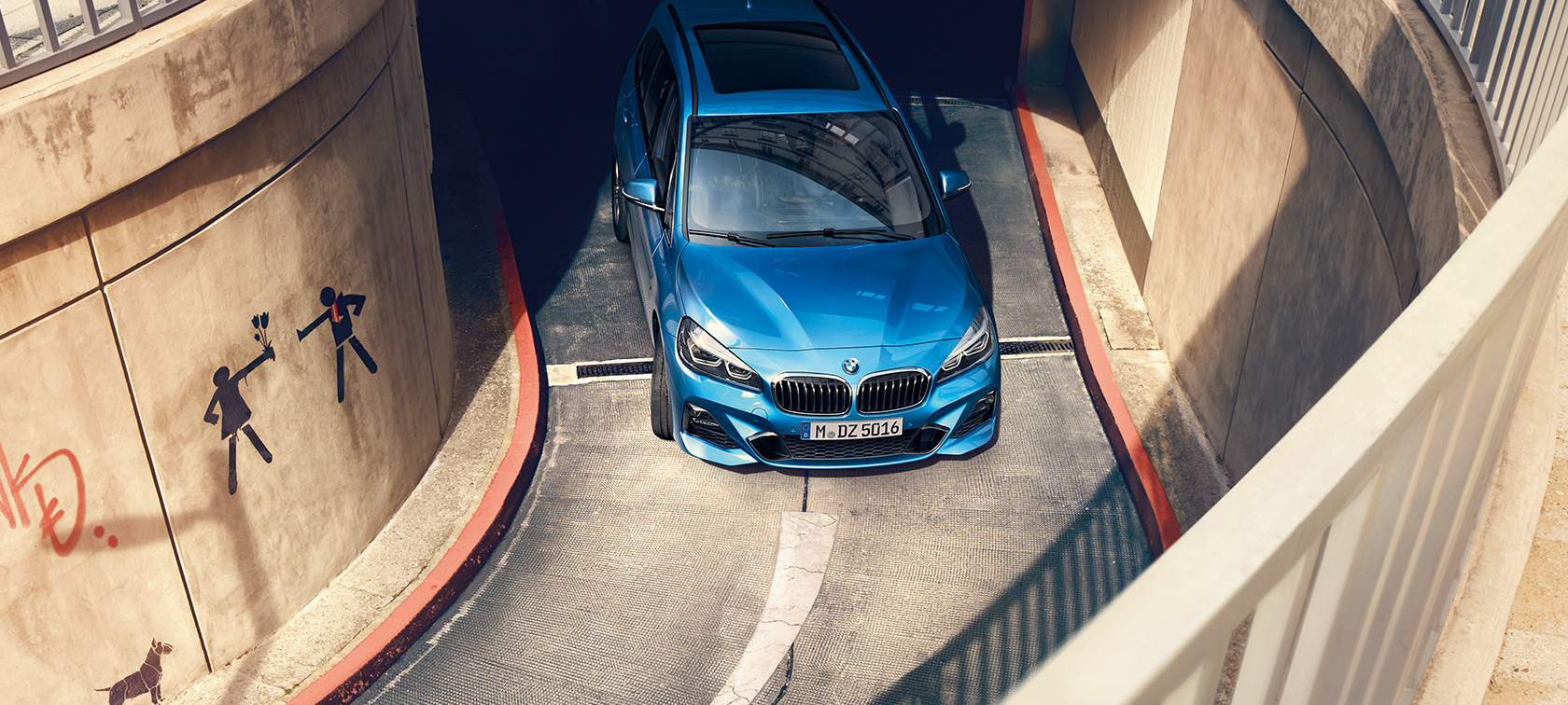BMW 2 Series Gran Tourer F46 Misano Blue metallic bird’s-eye view driving in multi-storey car park