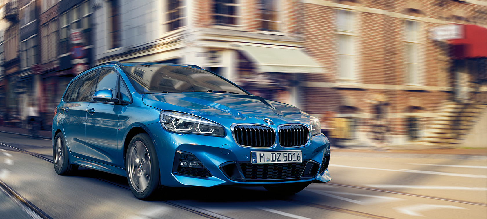 BMW 2 Series Gran Tourer driving on the road BMW 2 Series Gran Tourer F46 2018 Misano Blue metallic three-quarter front view driving on the road