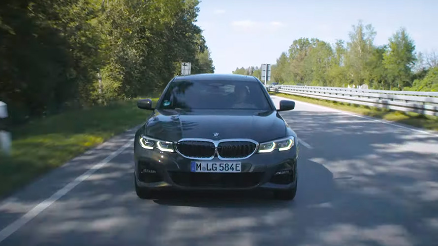BMW plug-in hybrid driving on the street BMW 3 Series Touring G21 BMW plug-in hybrid driving on the street front view