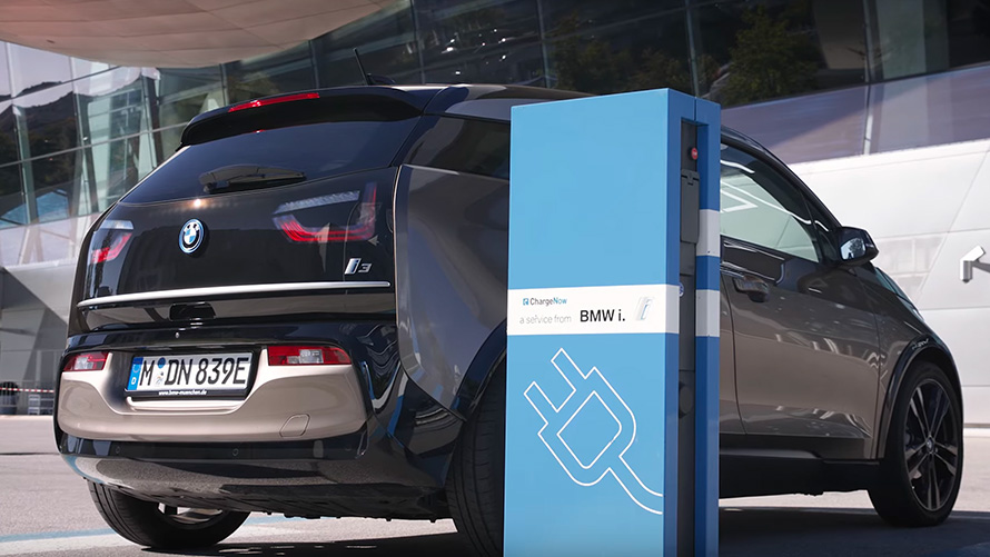 BMW i3 on charging station BMW 7 Series Sedan G11 G12 BMW i3 on charging station three-quarter rear view