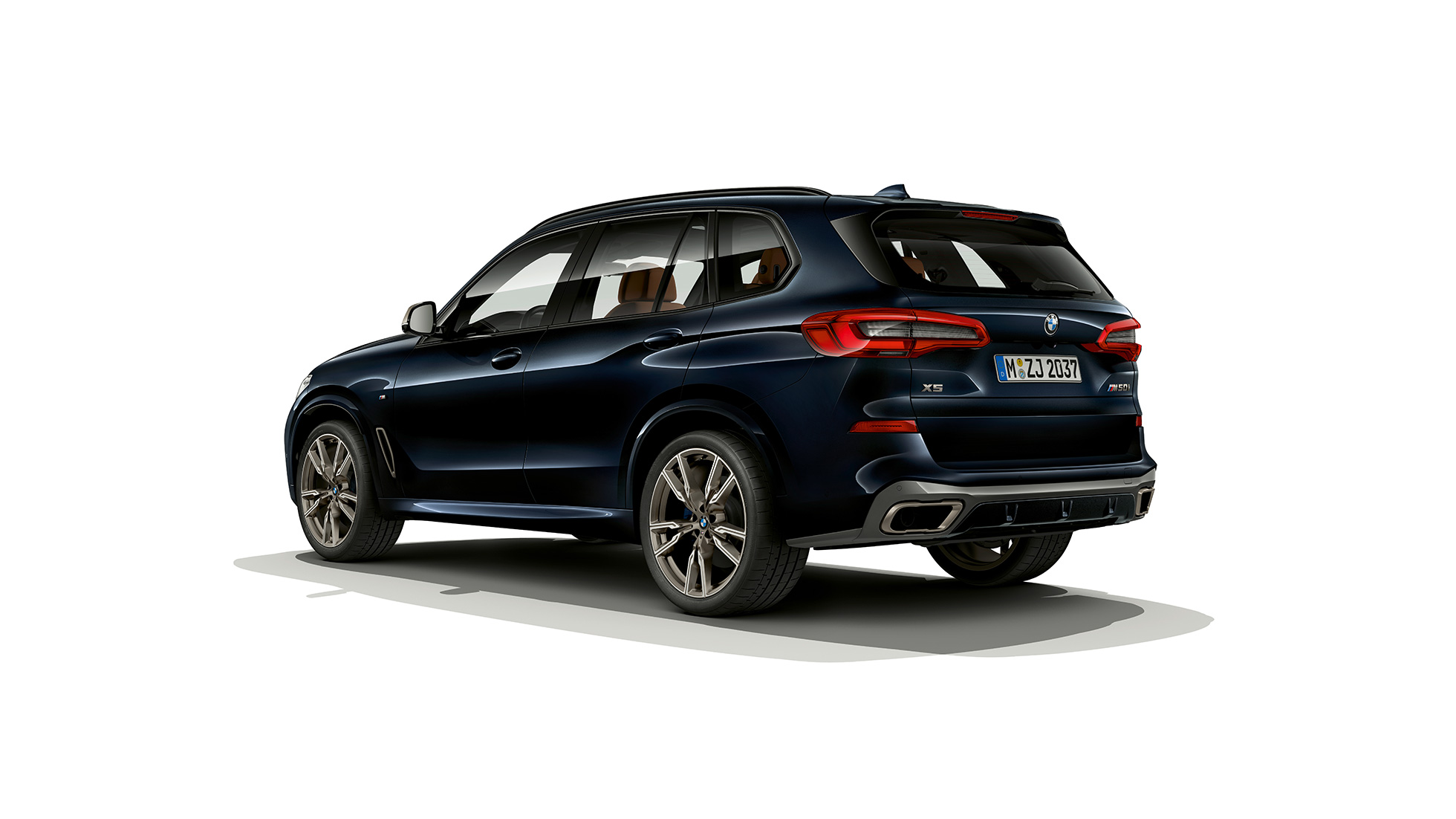BMW X5 M50i rear view BMW X5 M50i with M roof spoiler G05 Carbon black metallic rear view