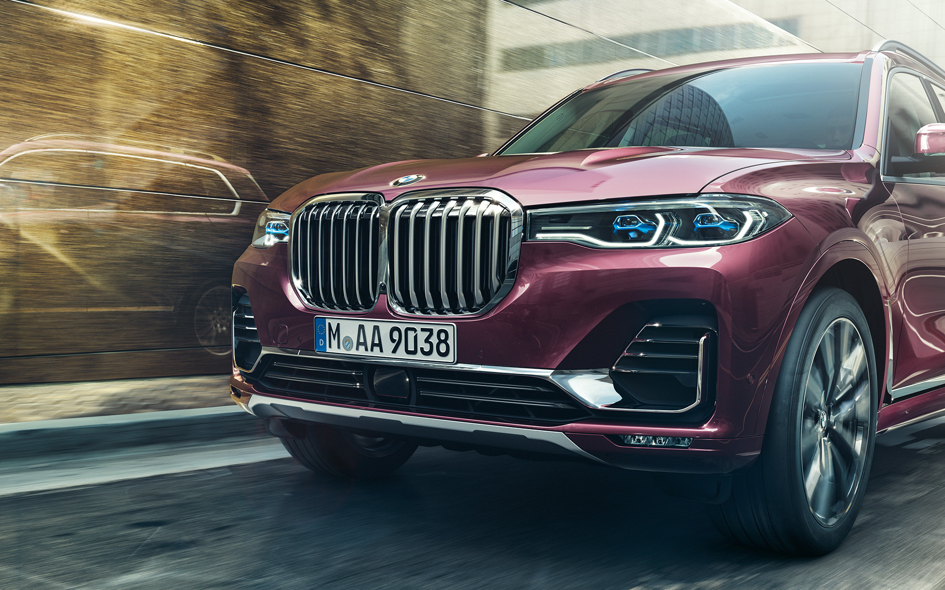 BMW X7 Individual xDrive40i G07 2018 ametrin metallic three-quarter front view driving BMW X7 Individual xDrive40i G07 2018 ametrin metallic three-quarter front view driving