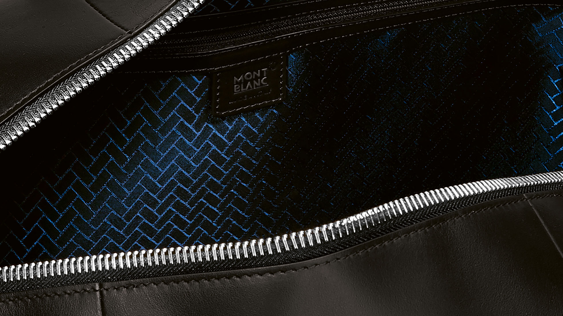 Montblanc for BMW Passport Cover. The picture shows a close-up view of the patterned surface of the Montblanc for BMW Duffle Bag.