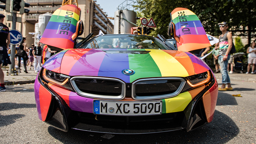 Diversity BMW Sustainability BMW Sustainability Diversity BMW vehicle front view in rainbow colors with open gull-wing doors