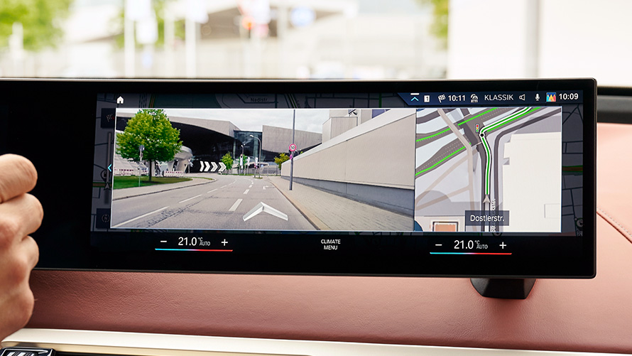 BMW Maps Connected Navigation Woman uses BMW Maps on her smartphone at home BMW Maps Connected Navigation Woman uses BMW Maps on her smartphone at home