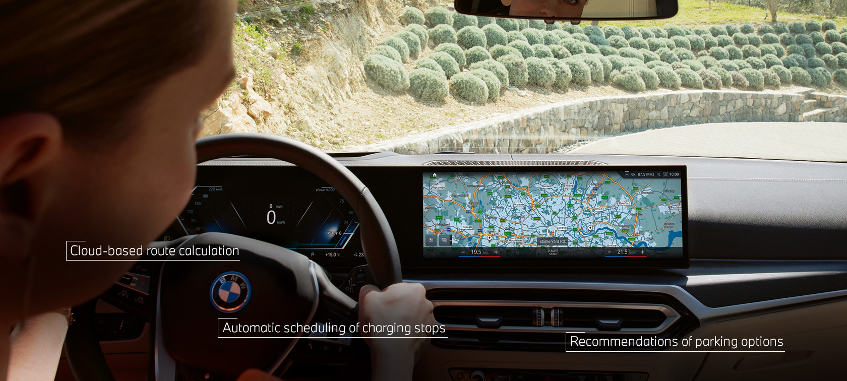 Man at the wheel of his BMW follows navigation instructions from BMW Maps in the Control Display Man at the wheel of his BMW follows navigation instructions from BMW Maps in the Control Display