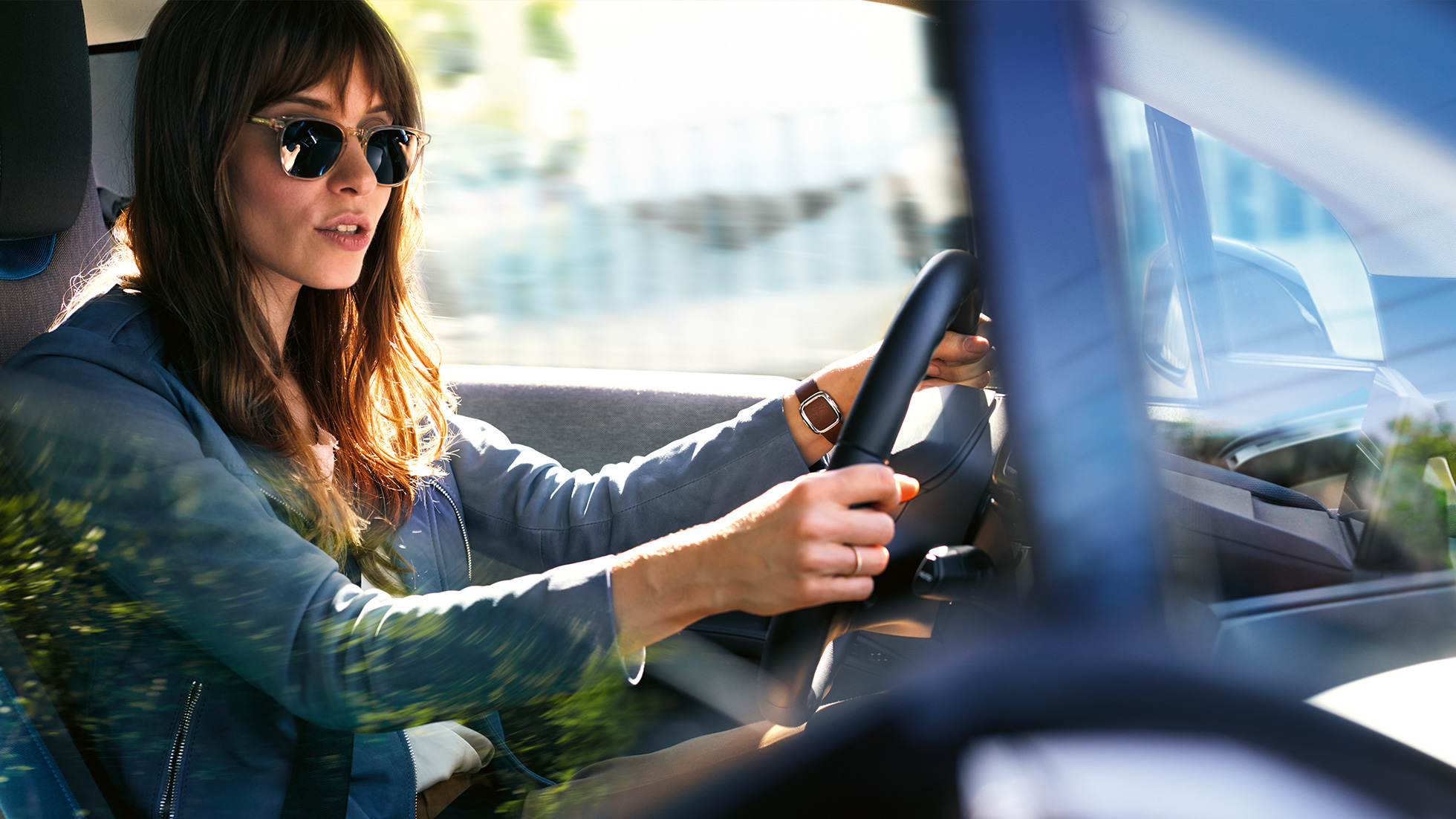 Woman using Amazon Alexa while driving in her BMW Woman using Amazon Alexa while driving in her BMW