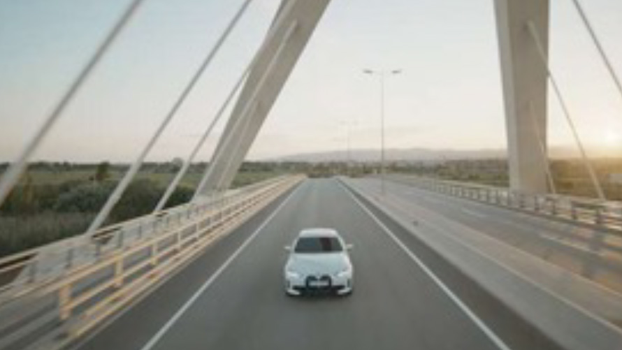 BMW IconicSounds Electric BMW on bridge BMW IconicSounds Electric BMW driving on bridge