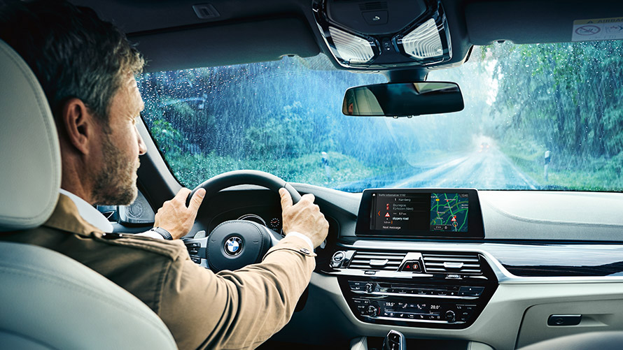 Real Time Traffic Information Man using Real Time Traffic Information on display in BMW