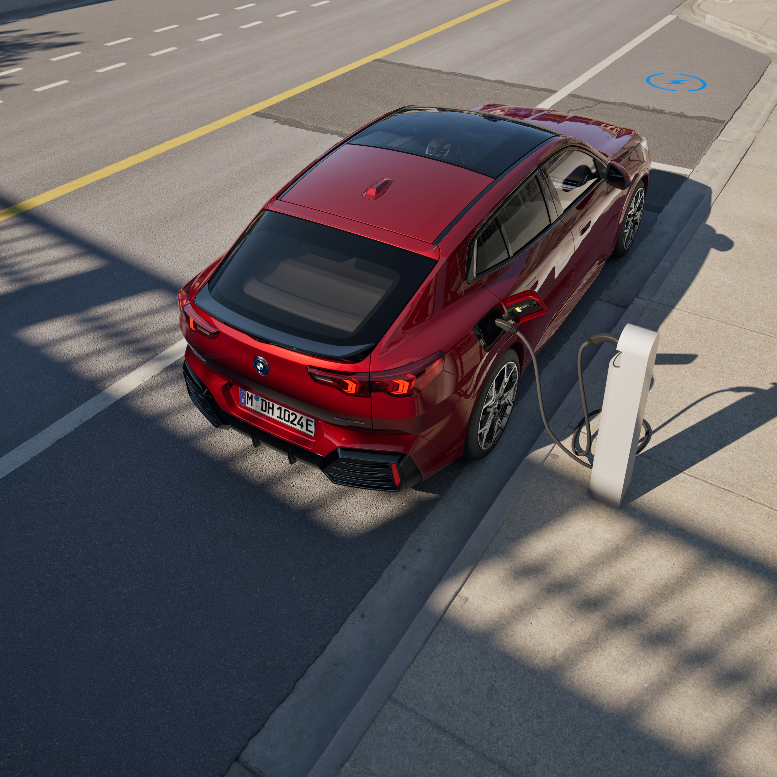 BMW charging at a charging post